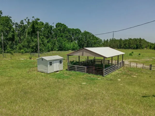 a view of a swimming pool and a yard