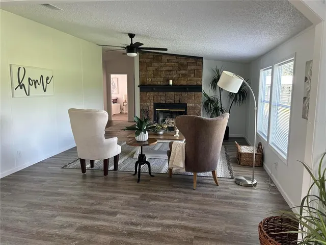 a living room with furniture and a table
