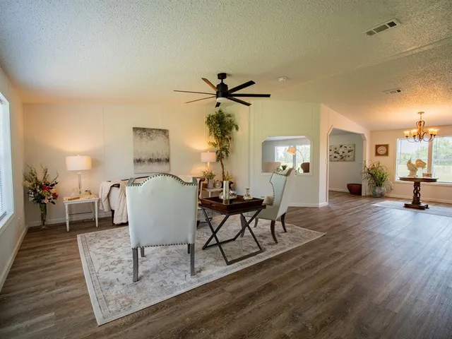a bed room with furniture and a window