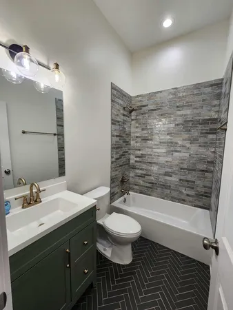 a bathroom with a sink and vanity