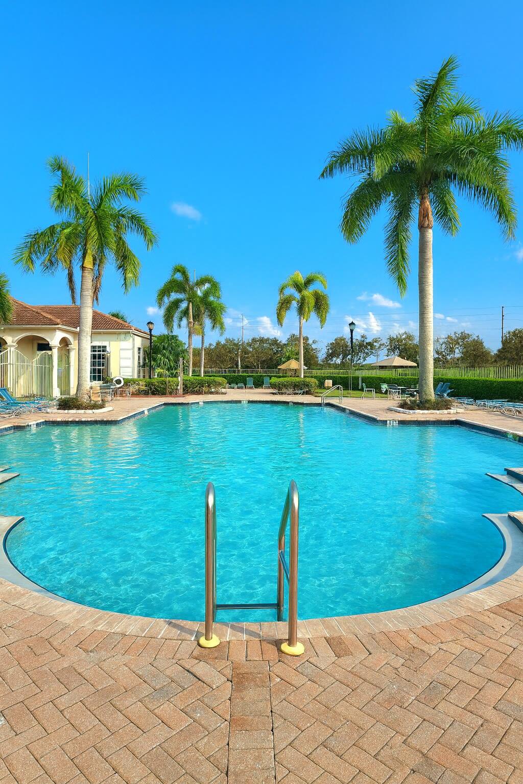 a view of a swimming pool and a yard