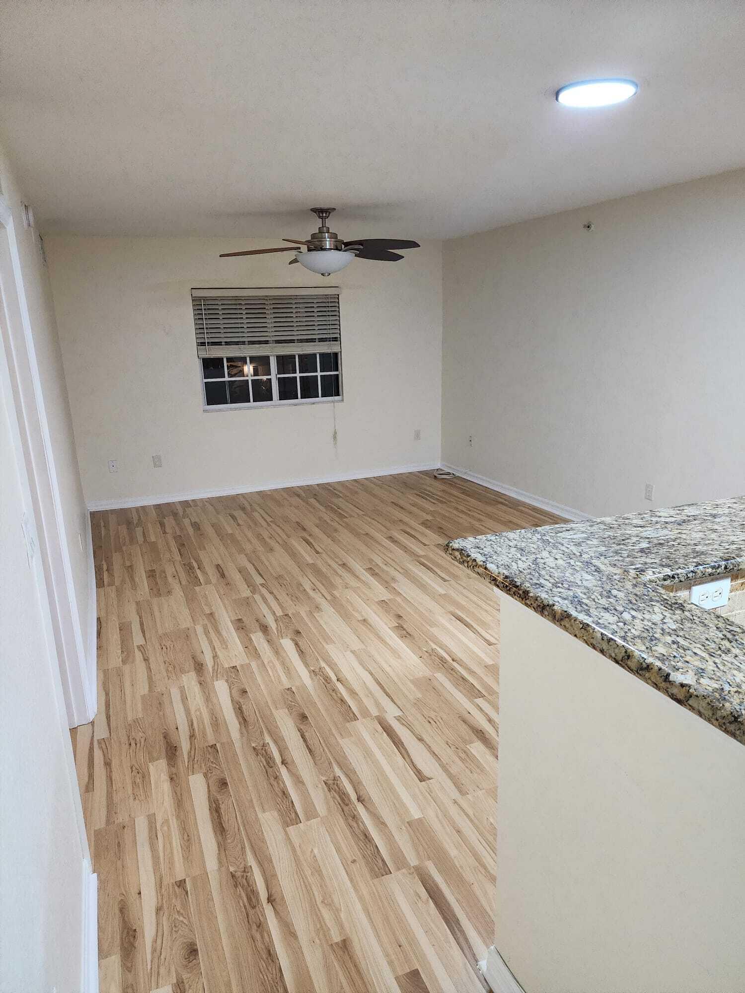 6777 Heritage Grande, Unit 1208 Boynton Beach, FL 33437 - Photo 12 of 17 a bedroom with a bed and a window