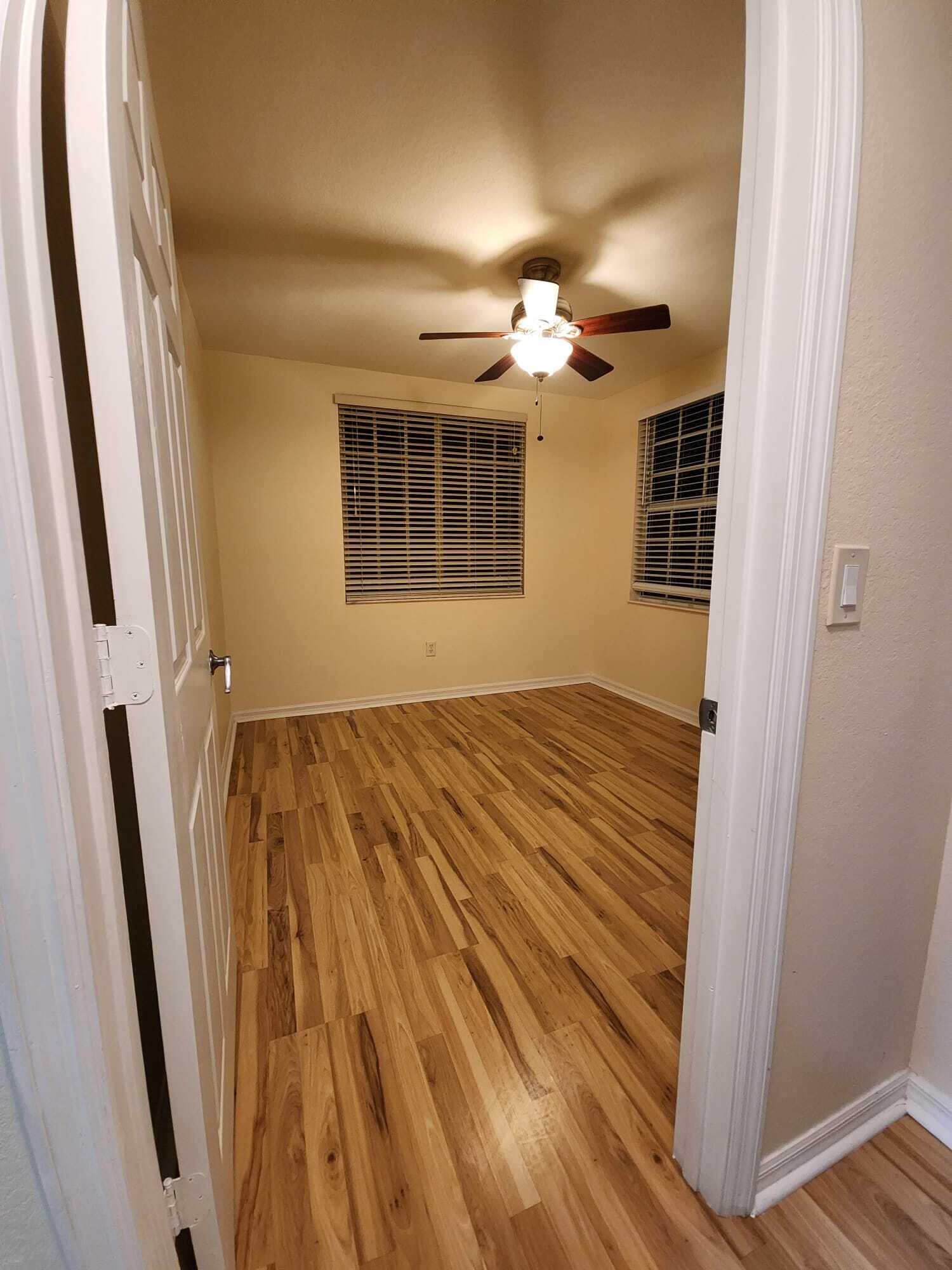6777 Heritage Grande, Unit 1208 Boynton Beach, FL 33437 - Photo 13 of 17 wooden floor in an empty room