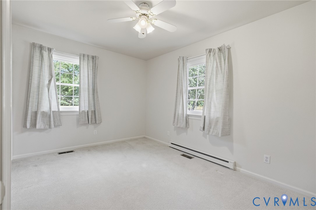 10215 River Road Petersburg, VA 23803 - Photo 19 of 31 Neutral-toned carpeting with white walls, dual win