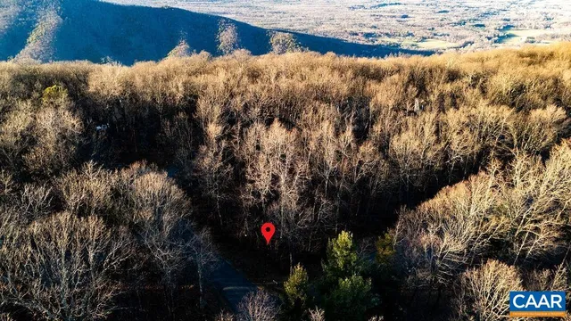 a view of mountains and valleys