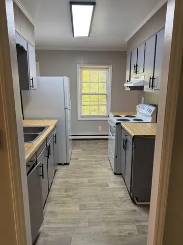 a kitchen with stainless steel appliances granite countertop a stove and a sink