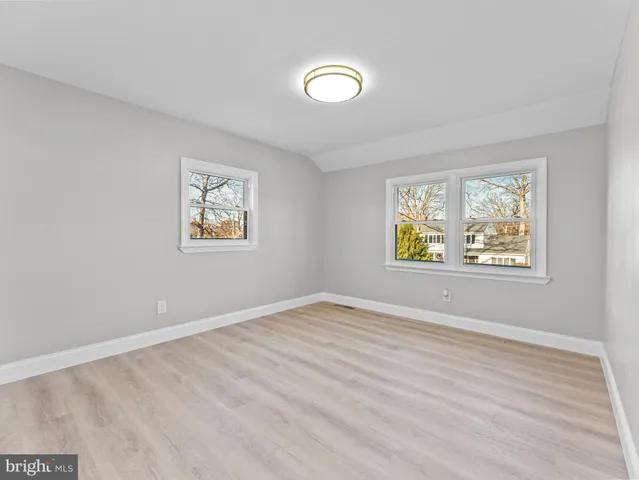 a view of room with wooden floor