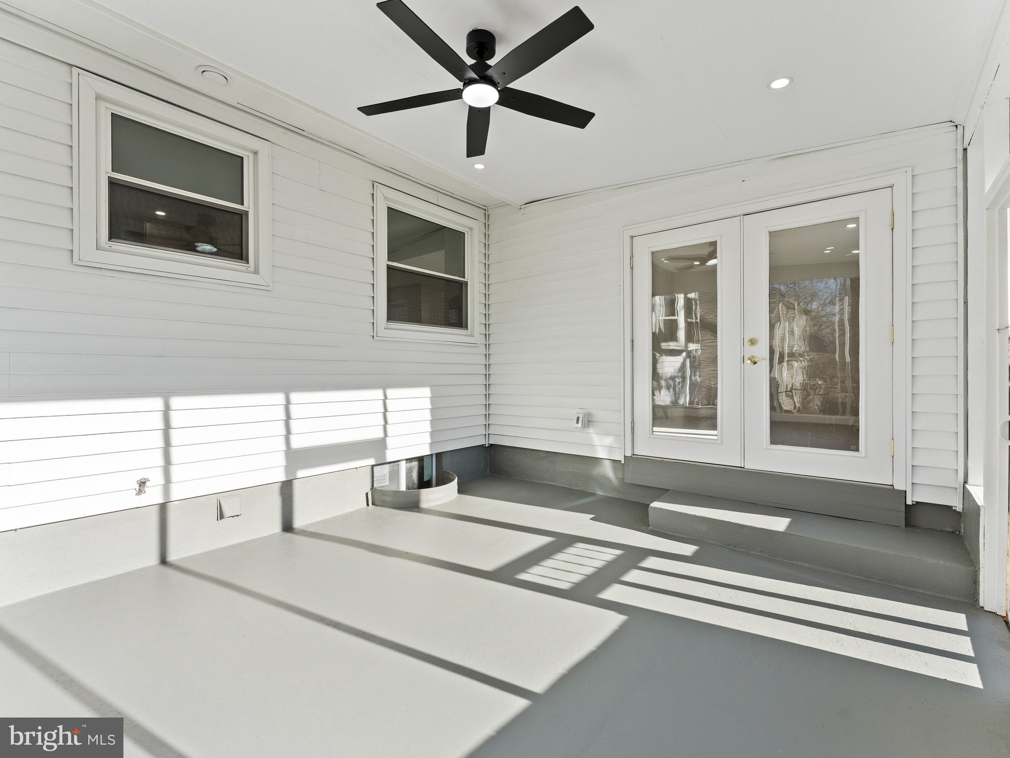 1202 Woodruff Road Glassboro, NJ 08028 - Photo 26 of 28 a living room with stainless steel appliances kitchen island granite countertop furniture and a fireplace