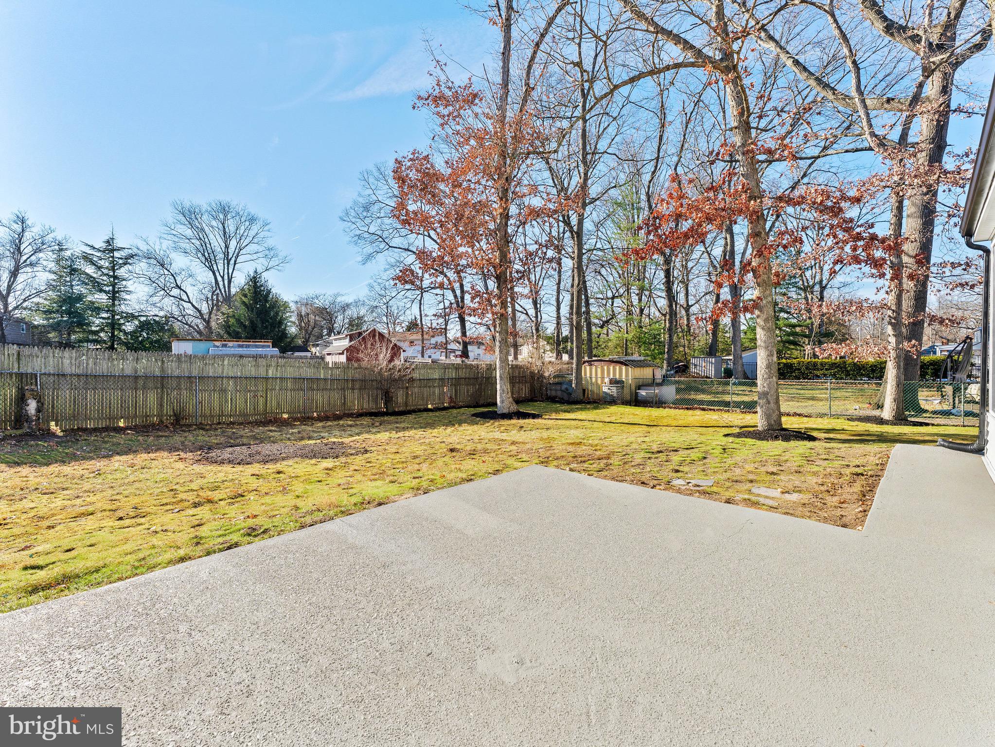 1202 Woodruff Road Glassboro, NJ 08028 - Photo 27 of 28 a view of yard with swimming pool and tree
