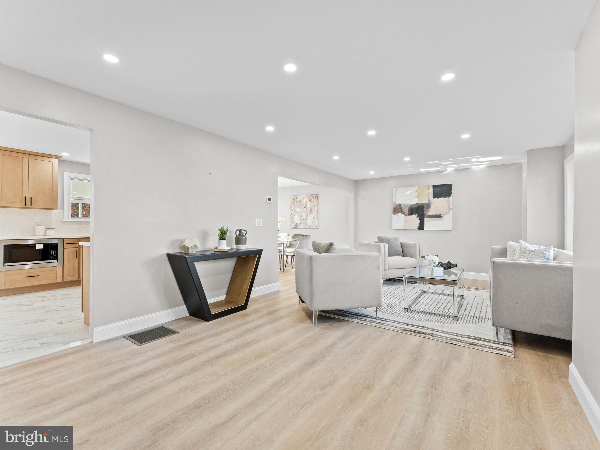 1202 Woodruff Road Glassboro, NJ 08028 - Photo 3 of 28 a living room with furniture and a wooden floor