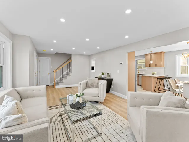 a living room with furniture and a table