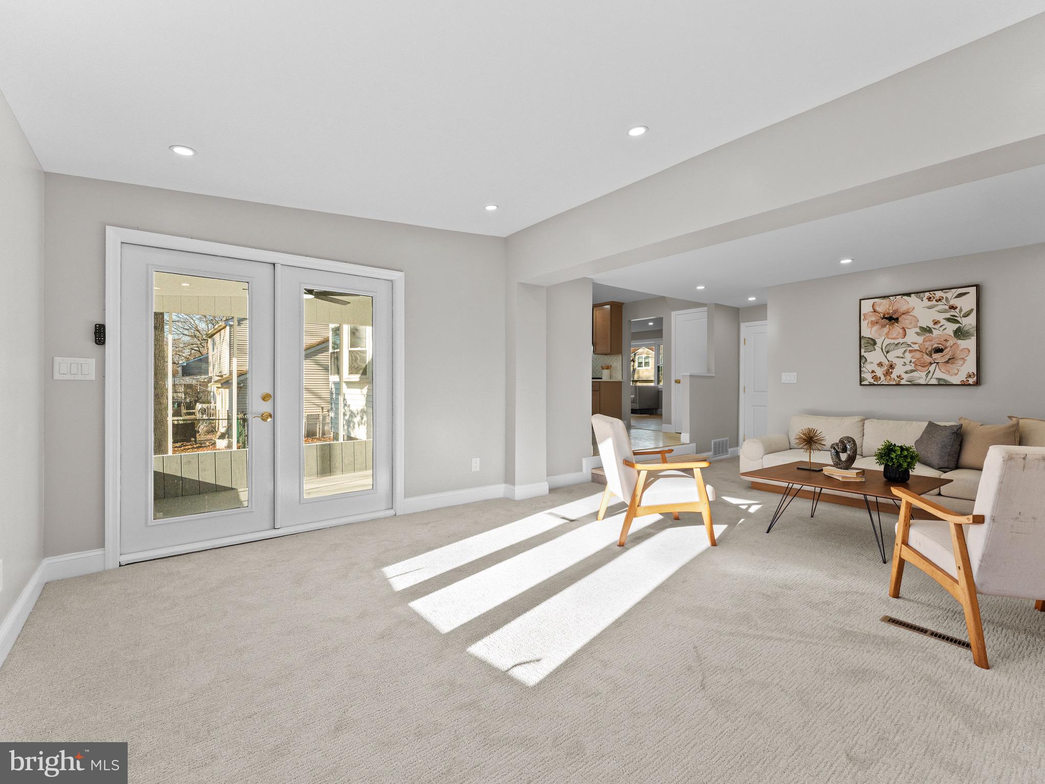 1202 Woodruff Road Glassboro, NJ 08028 - Photo 10 of 28 a living room with furniture and floor to ceiling window