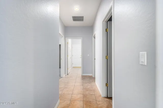 a view of a hallway with a room