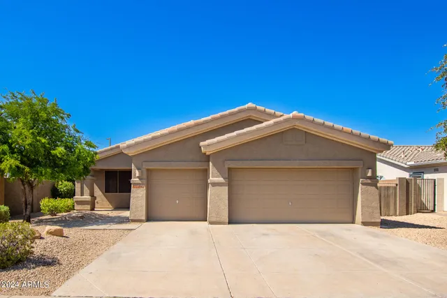 a front view of a house with a garage