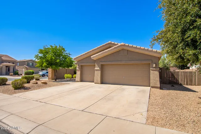 a front view of a house with a garage