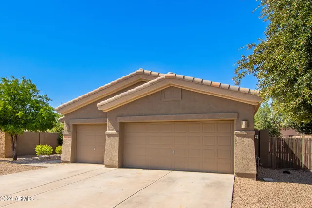 a front view of a house with a garage