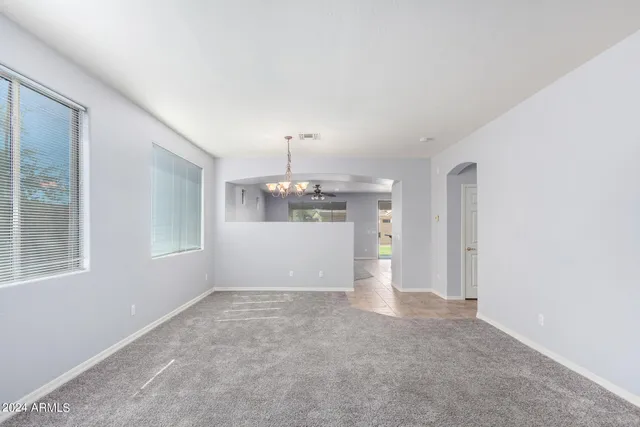 a view of a kitchen with a sink and cabinets