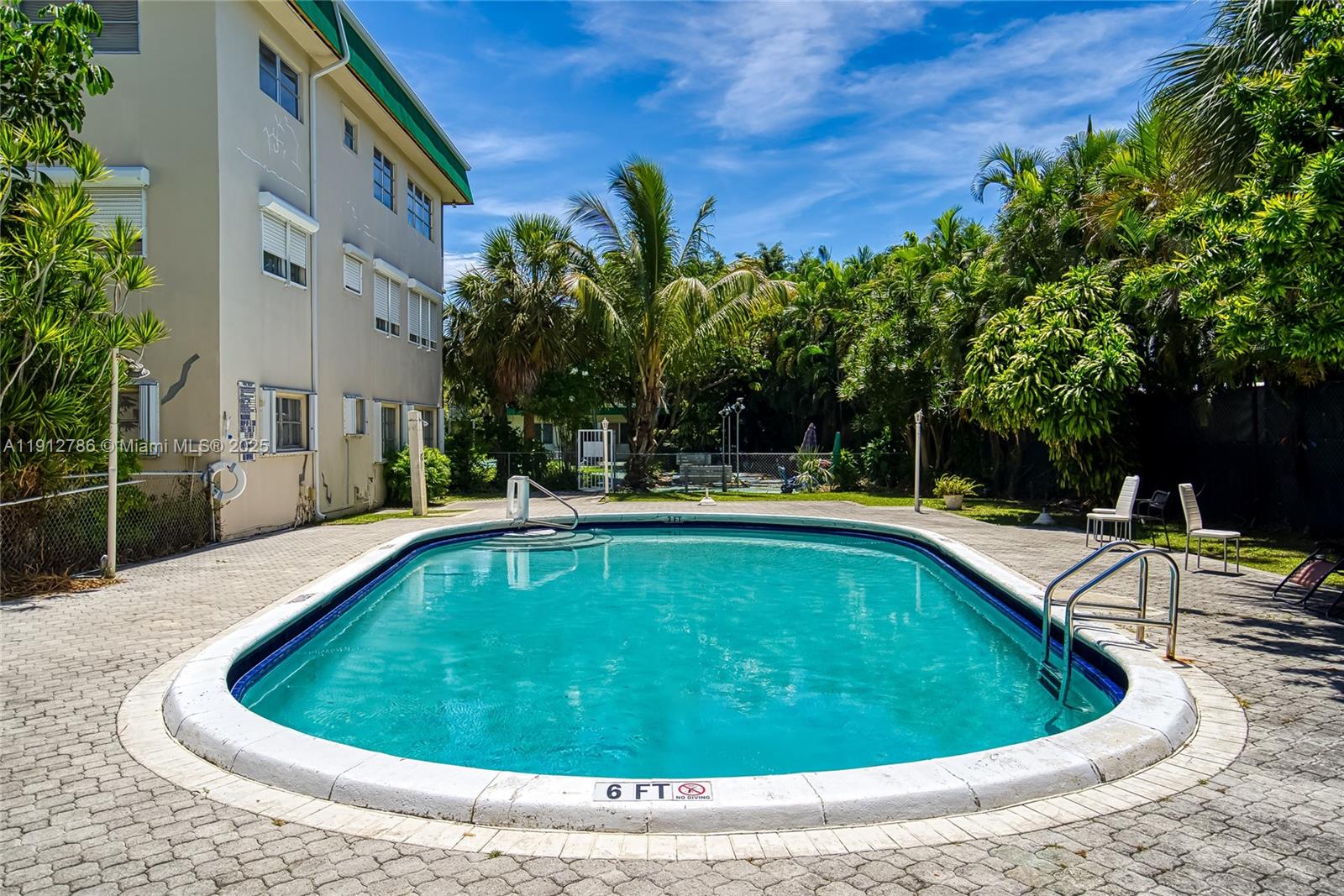 1420 Atlantic Shores Boulevard, Unit 340 Hallandale Beach, FL 33009 - Photo 17 of 33 a view of outdoor space yard swimming pool and patio
