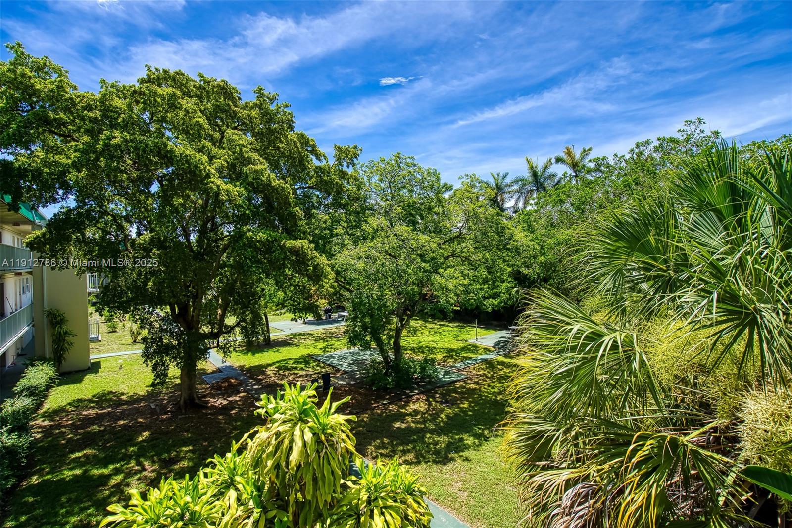1420 Atlantic Shores Boulevard, Unit 340 Hallandale Beach, FL 33009 - Photo 18 of 33 a view of a large yard with lots of green space