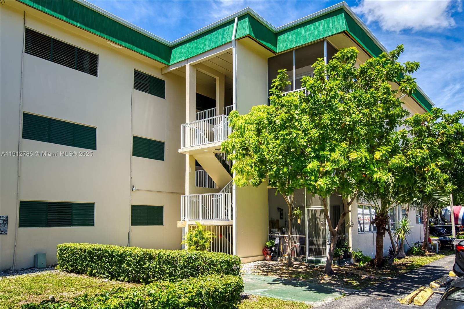 1420 Atlantic Shores Boulevard, Unit 340 Hallandale Beach, FL 33009 - Photo 24 of 33 a front view of a house with garden