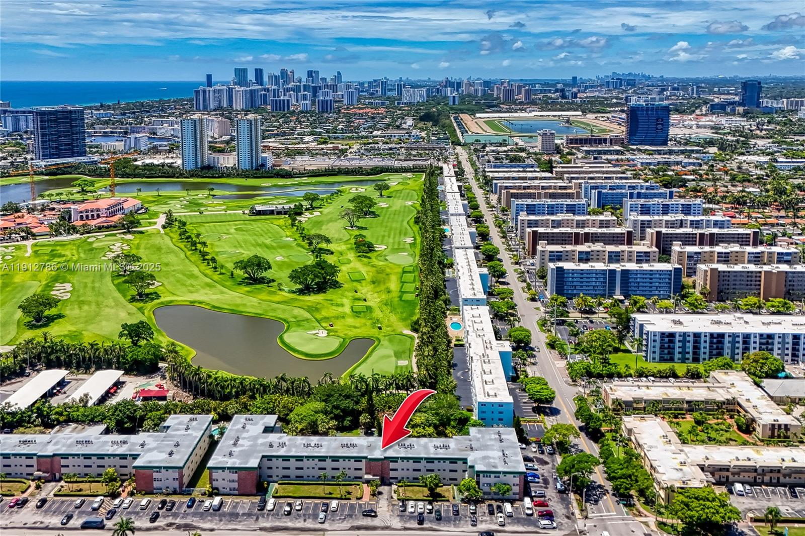 1420 Atlantic Shores Boulevard, Unit 340 Hallandale Beach, FL 33009 - Photo 32 of 33 a view of swimming pool with a garden and outdoor seating