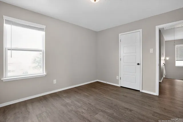a bathroom with a toilet and a bathtub