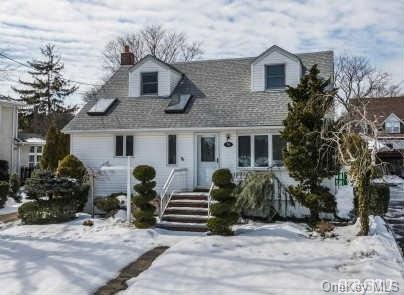 70 Chester Road Lynbrook, NY 11563 - Photo 1 of 1 a front view of a house with garden