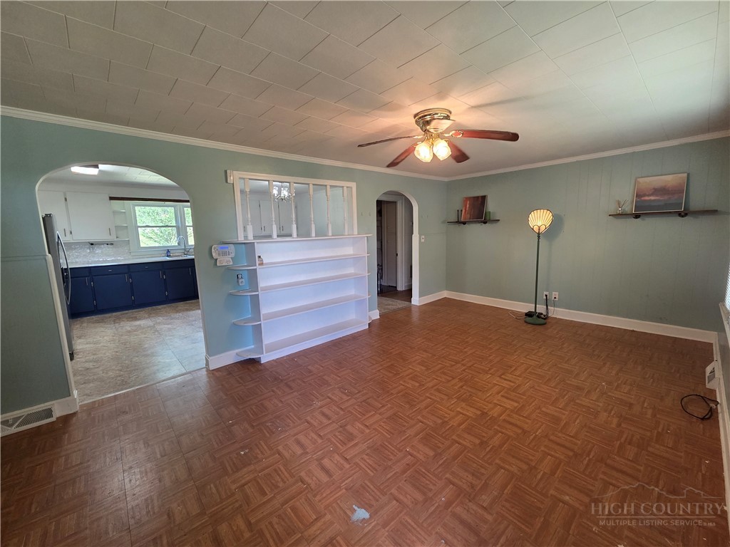 145 Black Oak Ridge Road Taylorsville, NC 28681 - Photo 10 of 39 a living room with furniture and a chandelier