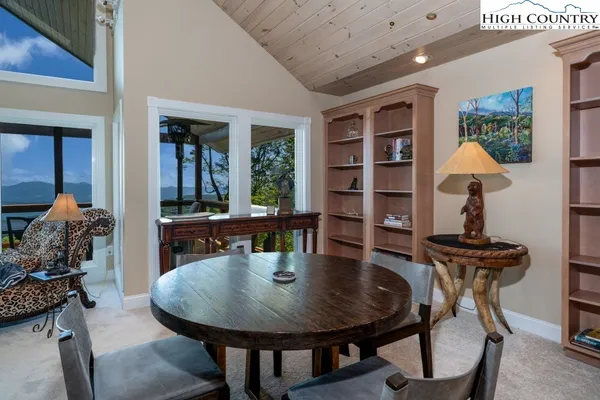 a dining room with furniture and window
