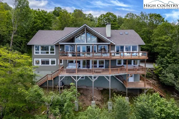 a aerial view of a house with a garden and deck