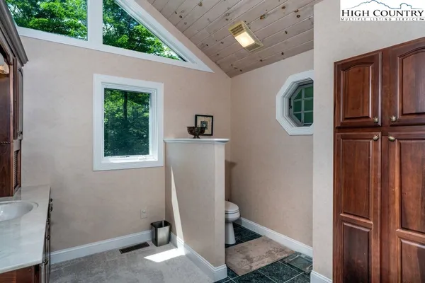 a view of a storage & utility room with a window