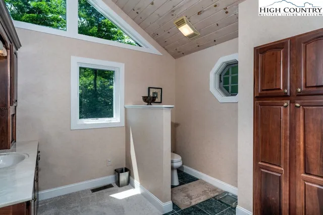 a view of a storage & utility room with a window