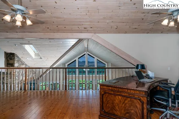 a roof deck with wooden floor