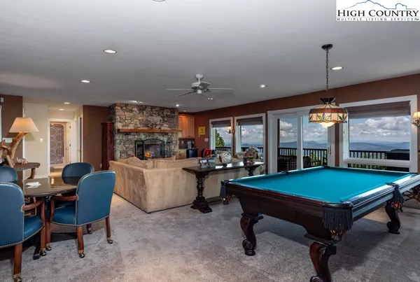 a room with furniture and pool table