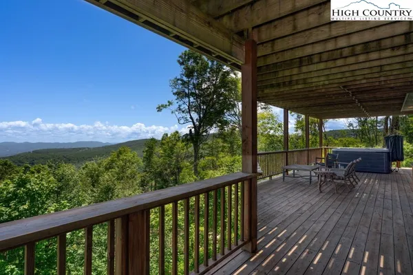 a view of a two chairs in the balcony