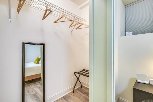 a bedroom with a bed and a desk