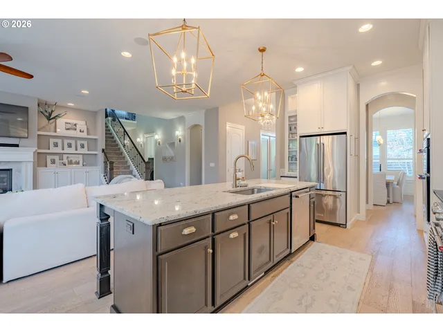 a bathroom with a granite countertop sink a large mirror and a shower