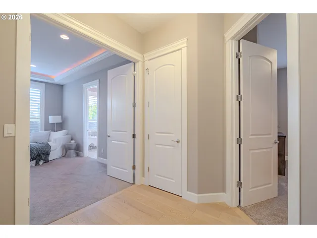 a bedroom with a bed and a large mirror