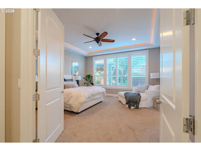 a living room with furniture and large windows