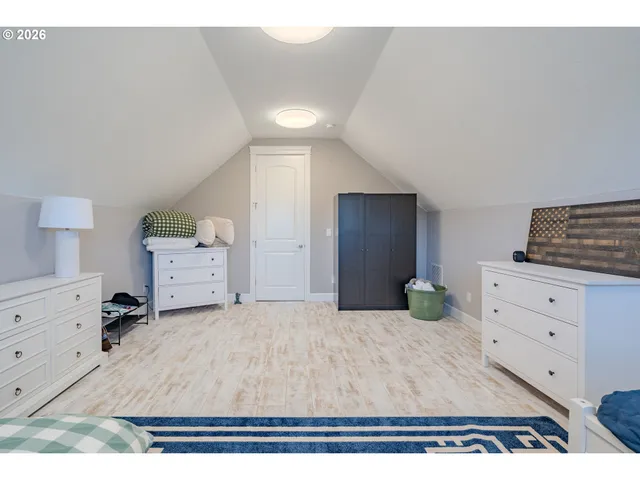 a bedroom with a bed and cabinets