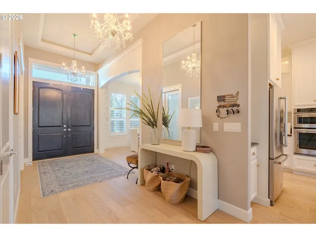 a living room with stainless steel appliances kitchen island granite countertop furniture and a kitchen view