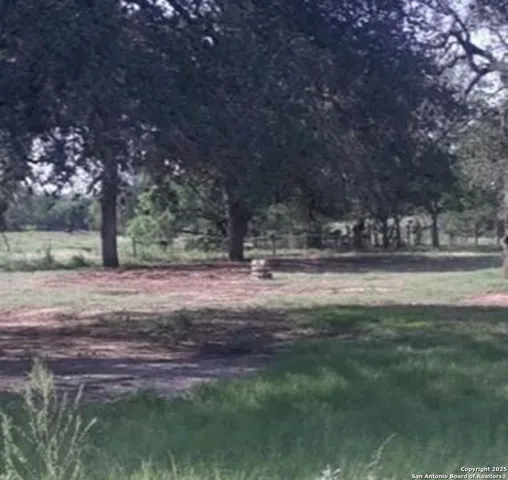 a view of outdoor space with deck and yard