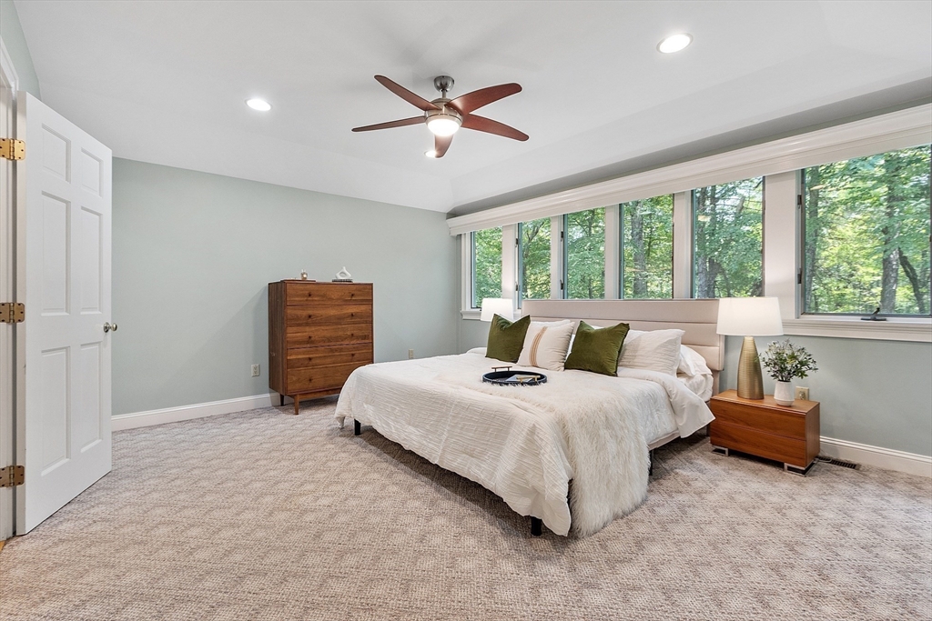 151 Pope Road Acton, MA 01720 - Photo 21 of 34 a spacious bedroom with a bed and window