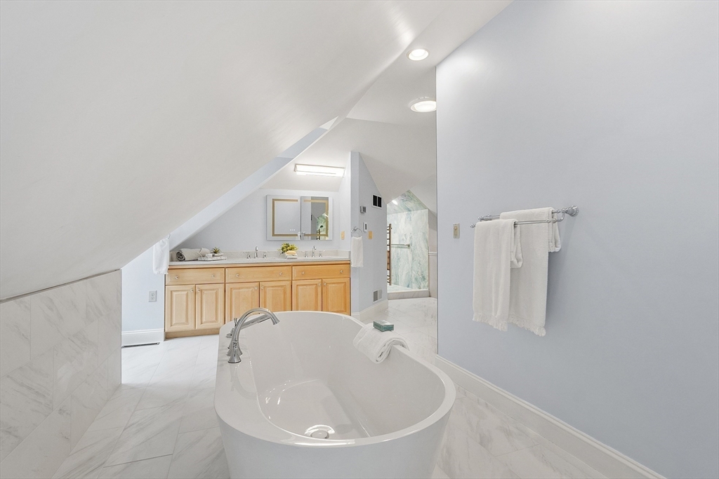 151 Pope Road Acton, MA 01720 - Photo 25 of 34 a bathroom with a tub sink and mirror