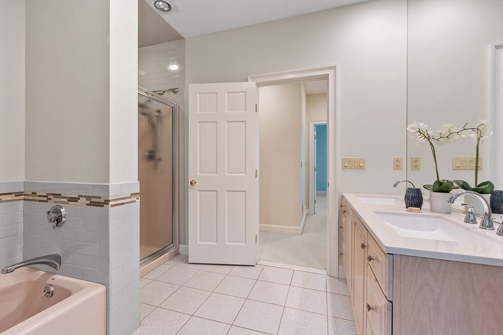 151 Pope Road Acton, MA 01720 - Photo 28 of 34 a bathroom with a sink a tub and a mirror