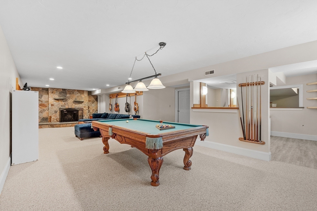151 Pope Road Acton, MA 01720 - Photo 30 of 34 a room with lots of furniture and air hockey table