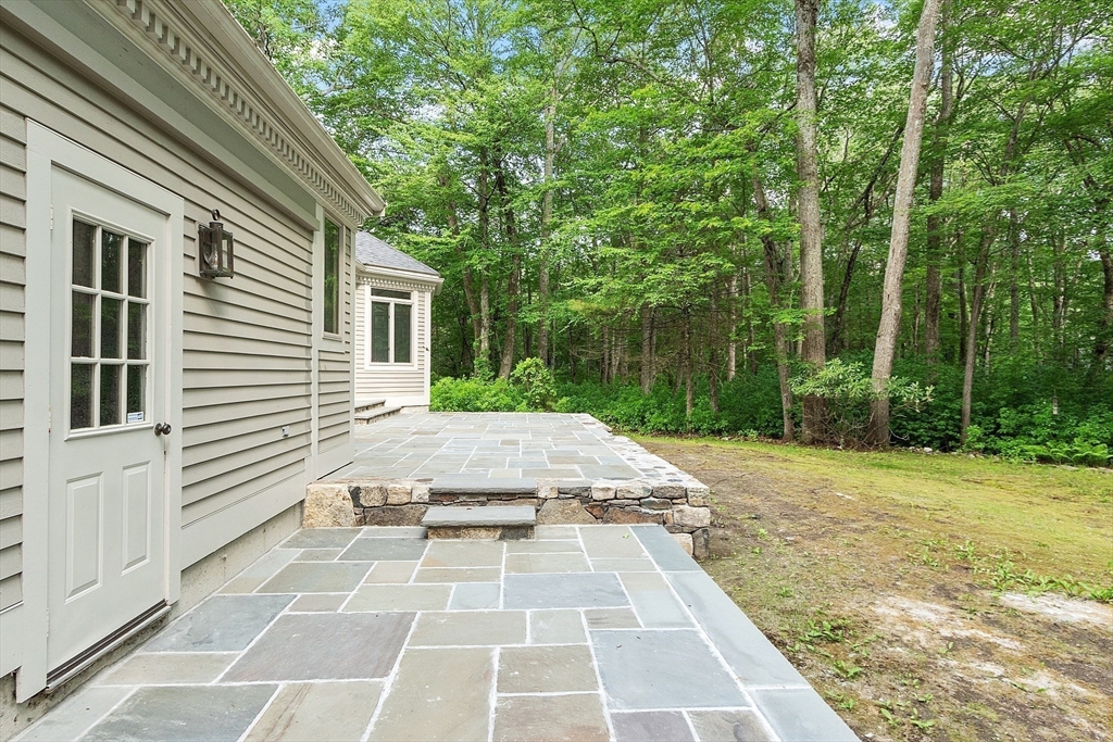 151 Pope Road Acton, MA 01720 - Photo 33 of 34 a view of a backyard with a patio