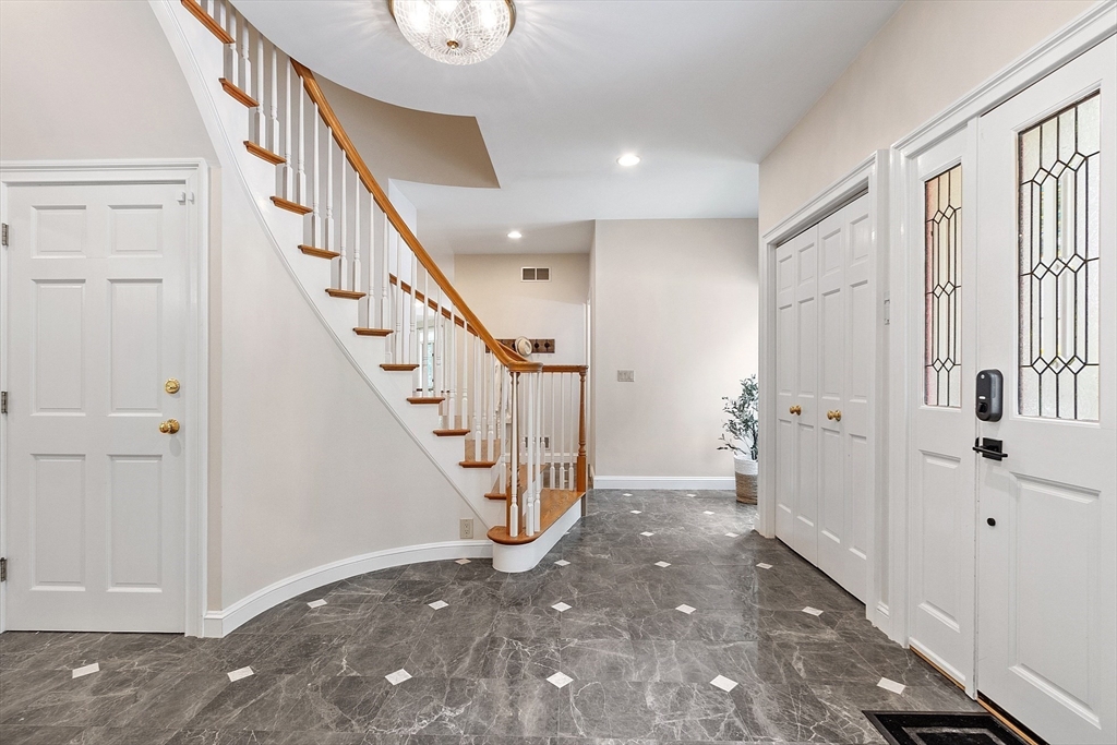 151 Pope Road Acton, MA 01720 - Photo 4 of 34 a view of an entryway with staircase