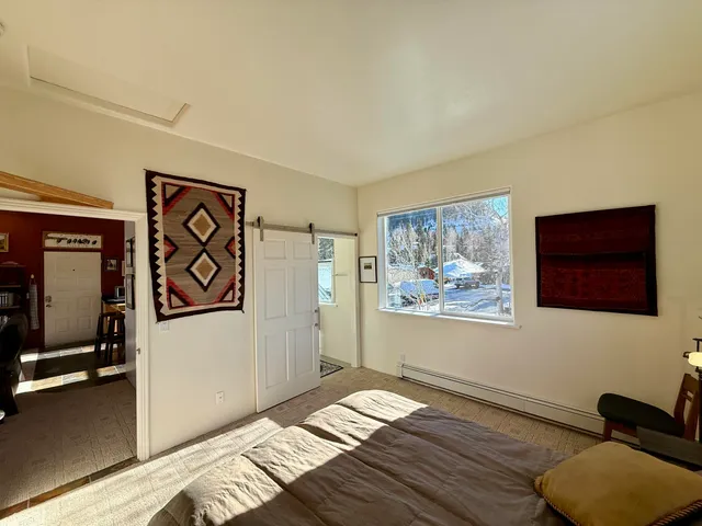 a view of workspace with wooden floor and window