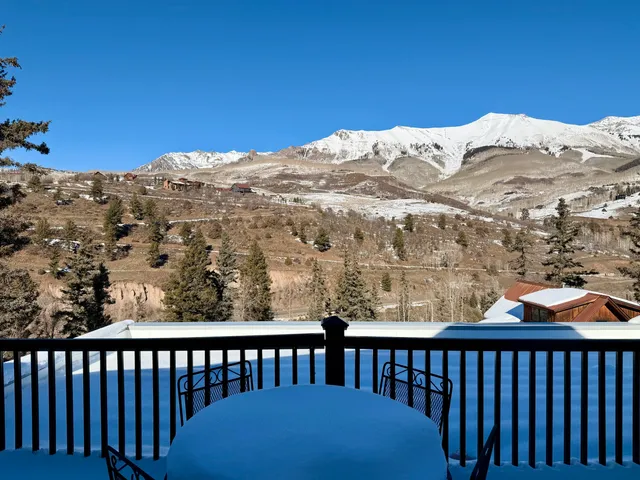 a view of a balcony with an ocean view